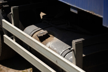 The fuel tank cap in the sun. the diesel tank of a truck is in the sun with the dirty cap.