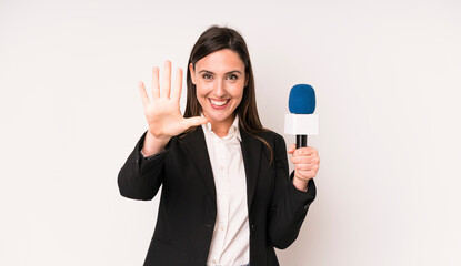 young adult pretty woman smiling and looking friendly, showing number five. presenter with a...