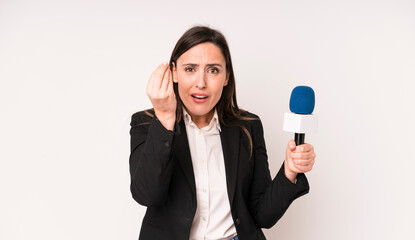 young adult pretty woman making capice or money gesture, telling you to pay. presenter with a...