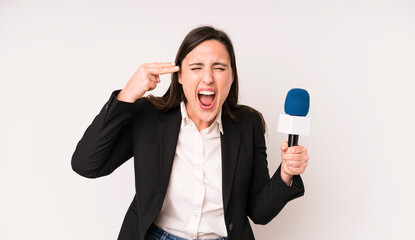 young adult pretty woman looking unhappy and stressed, suicide gesture making gun sign. presenter...