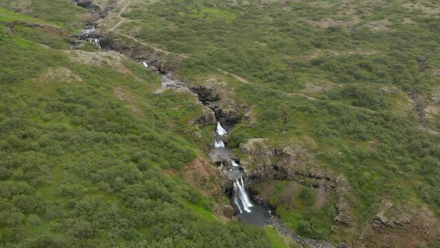 Aerial drone shot Mountain panorama, volcanic landscape and river, glacier river from above, aerial view, river arms meandering, wild nature, Icelandic Highlands, Pakgil, Suourland, Iceland