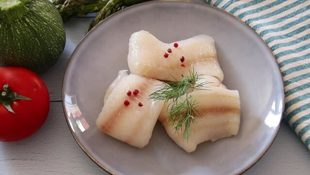 Raw Halibut Fillet In A Plate On A Table