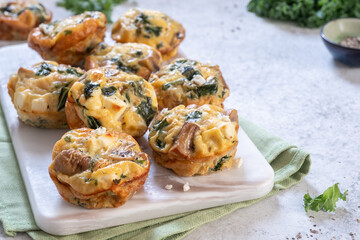 Vegetarian egg muffins with mushroom, kale and feta cheese for Breakfast