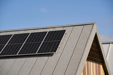 State-of-the-art solar panels placed on the roofs of houses of ecological construction