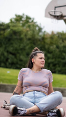 girl sitting on basketball court