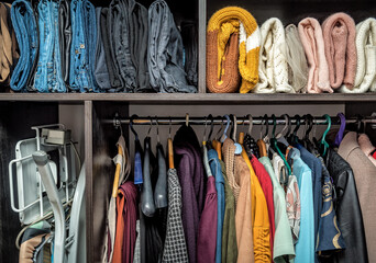 Different color of clothes in the wardrobe