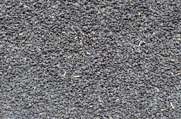 Nigella seeds texture close up photo. Natural pattern. Abstract natural background. 