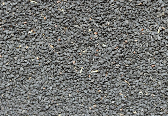 Nigella seeds texture close up photo. Natural pattern. Abstract natural background. 