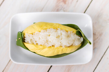 Durian with sweet sticky rice and coconut milk on top (Khao Niao Thu Lien). Thai style tropical...