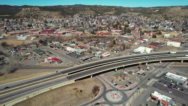 Aerial View of International American CanAm Highway Passing Trinidad, Colorado USA on Sunny Day, Drone Shot