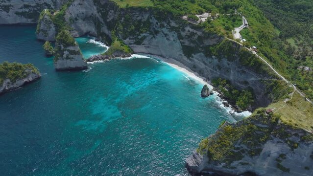Diamond beach on Nusa Penida with clear blue tropical water, aerial