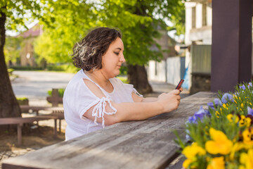 Business woman on street using mobile and having call.