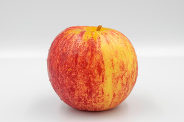 Fresh red yellow apple on white background