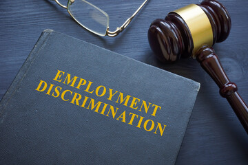 Law about employment discrimination and gavel on the table. - obrazy, fototapety, plakaty