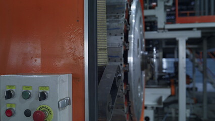 Robotic tyre production equipment working at modern automotive warehouse closeup