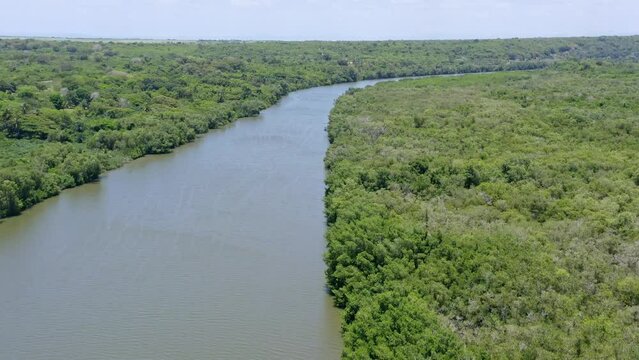 Aerial flyover idyllic Rio Soco in wilderness during sunny day in nature of Dominican Republic