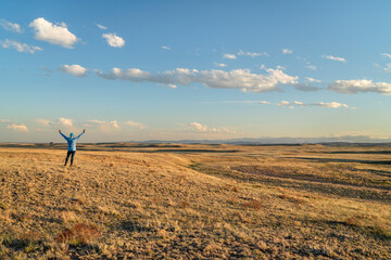 prairie in northern Colorado at early spring sunset with a lonely male figure - Soapstone Prairie...