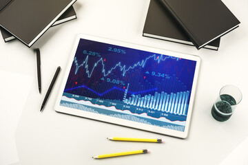 Top view of abstract creative financial graph on modern digital tablet screen, forex and investment concept. 3D Rendering