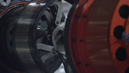 Detailed automobile tyre plant mechanism moving in automotive workhouse closeup