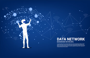 Silhouette businessman wear VR glasses with dot connect line polygon mobile data icon. Concept of digital virtual reality technology and AR .