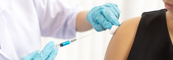 Doctor is vaccinating women with antibiotics or new antibodies to prevent the spread of the virus,...