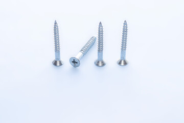 screw different sizes in a row and one is down,light blue background. Stainless bolt. Hardware repair tools isolated, free space for text, copy paste. be, think  different, unique concept