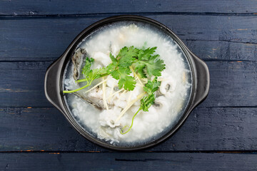 Chinese cuisine; Congee with fish slices in casserole