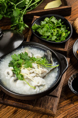 Chinese cuisine; Congee with fish slices in casserole