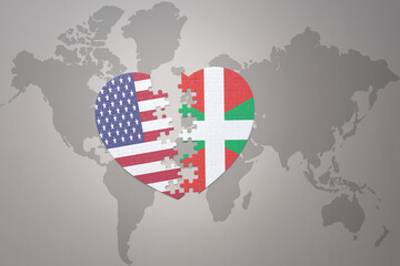 puzzle heart with the national flag of united states of america and basque country on a world map...