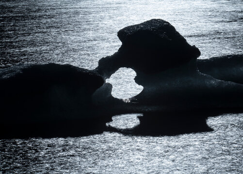 Icebergs dot the shore of Laguna Torre, abstracted by a long exp