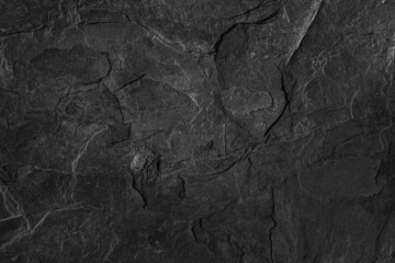 Dark grey black slate background or texture. Black granite slabs background.