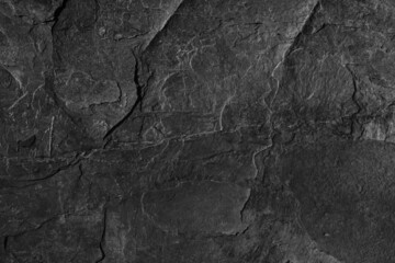 Dark grey black slate background or texture. Black granite slabs background.	