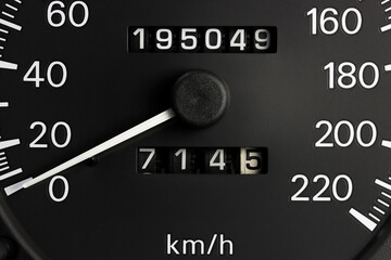 odometer of used car showing mileage of 195049 km