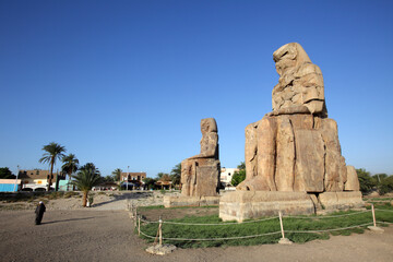 The Colossi of Memnon, the massive stone statues of Pharaoh Amenhotep III, Luxor, Egypt