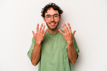 Young caucasian man isolated on white background showing number ten with hands.