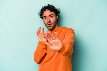 Young caucasian man isolated on white background being shocked due to an imminent danger