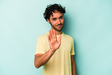 Young caucasian man isolated on white background rejecting someone showing a gesture of disgust.