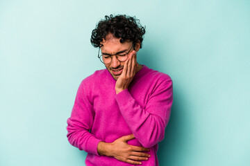 Young caucasian man isolated on white background laughs happily and has fun keeping hands on stomach.