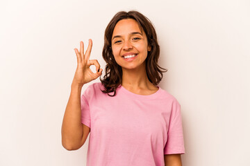 Young hispanic woman isolated on white background cheerful and confident showing ok gesture.