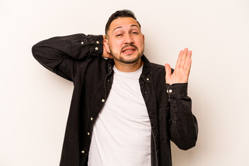 Young hispanic man isolated on white background screaming with rage.