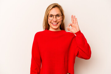 Young caucasian woman isolated on white background cheerful and confident showing ok gesture.