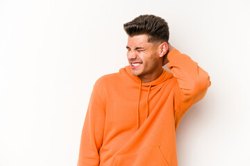 Young caucasian man isolated on white background suffering neck pain due to sedentary lifestyle.