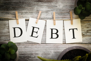 The Word Debt Concept Printed on Cards