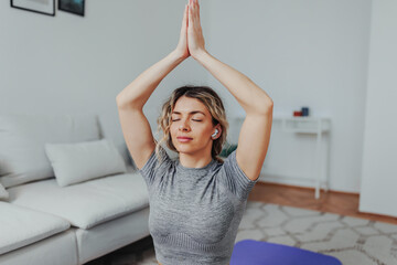 Young woman doing Pilates at home