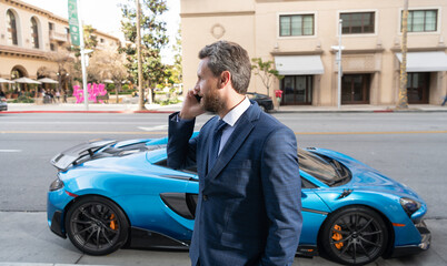 car rent dealer speak on phone outdoor