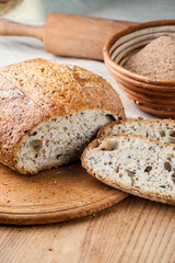 Bread. Baked bread. Craft bakery. Sliced bread on a wooden background. Food blog, food, pastries, flour, hot, fragrant, morning, fresh bread