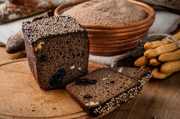 Bread. Baked bread. Craft bakery. Sliced bread on a wooden background. Food blog, food, pastries, flour, hot, fragrant, morning, fresh bread