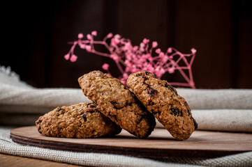 Cookies with chocolate crumbs. American cookies. Shortbread. Baking on a wooden background. Yellow, chocolate, sweet, food, dessert