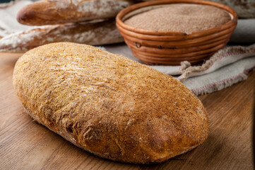Obraz na płótnie Canvas Bread. Baked bread. Craft bakery. Sliced bread on a wooden background. Food blog, food, pastries, flour, hot, fragrant, morning, fresh bread
