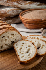 Bread. Baked bread. Craft bakery. Sliced bread on a wooden background. Food blog, food, pastries, flour, hot, fragrant, morning, fresh bread